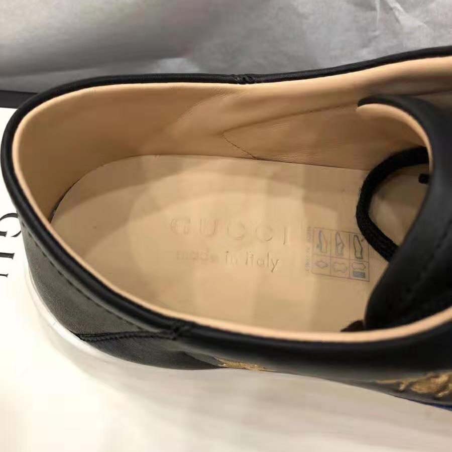 G*u*i men’s ace embroidered sneaker in black leather with bees and stars