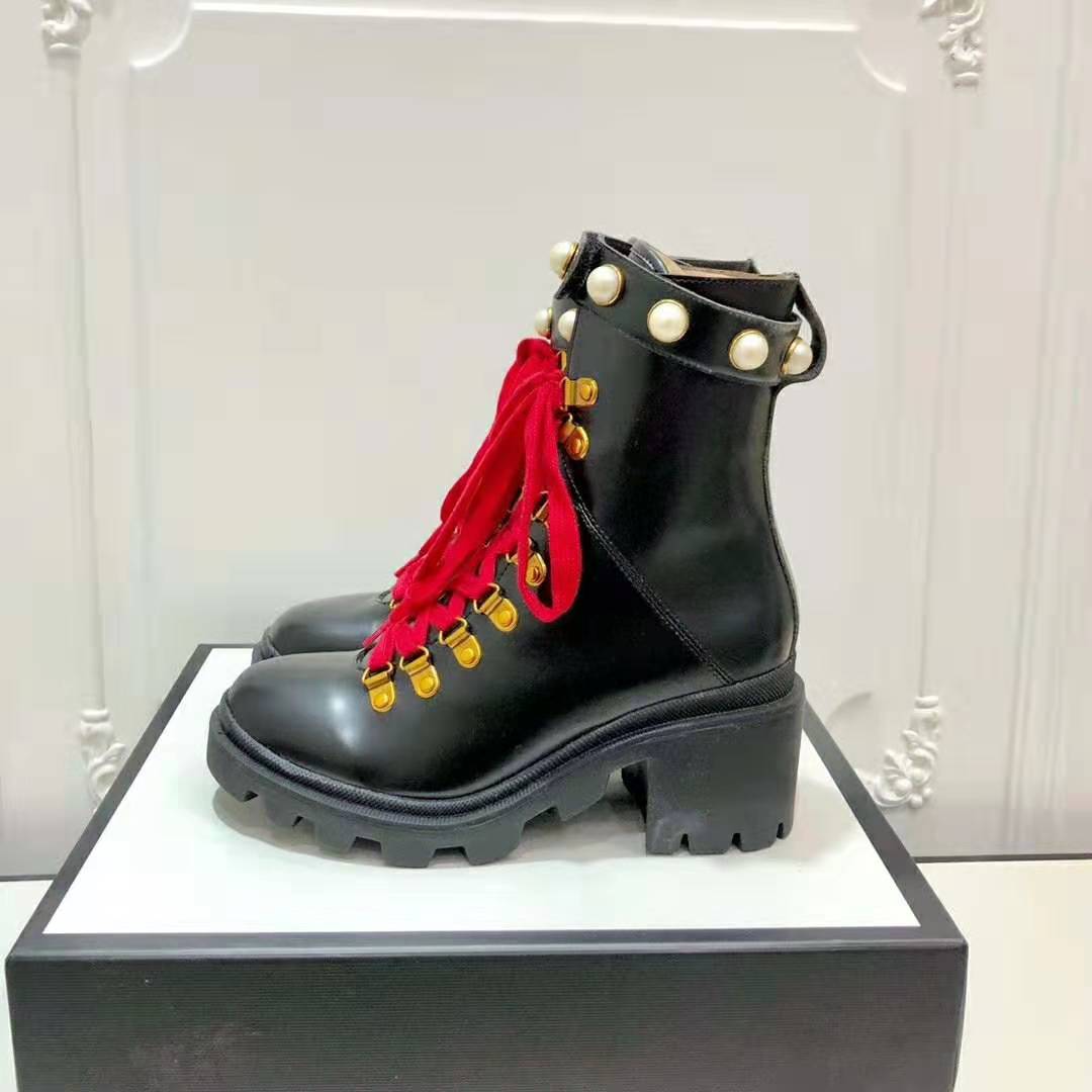 G*u*i women G*u*i leather ankle boot in black shiny leather 7.6 cm