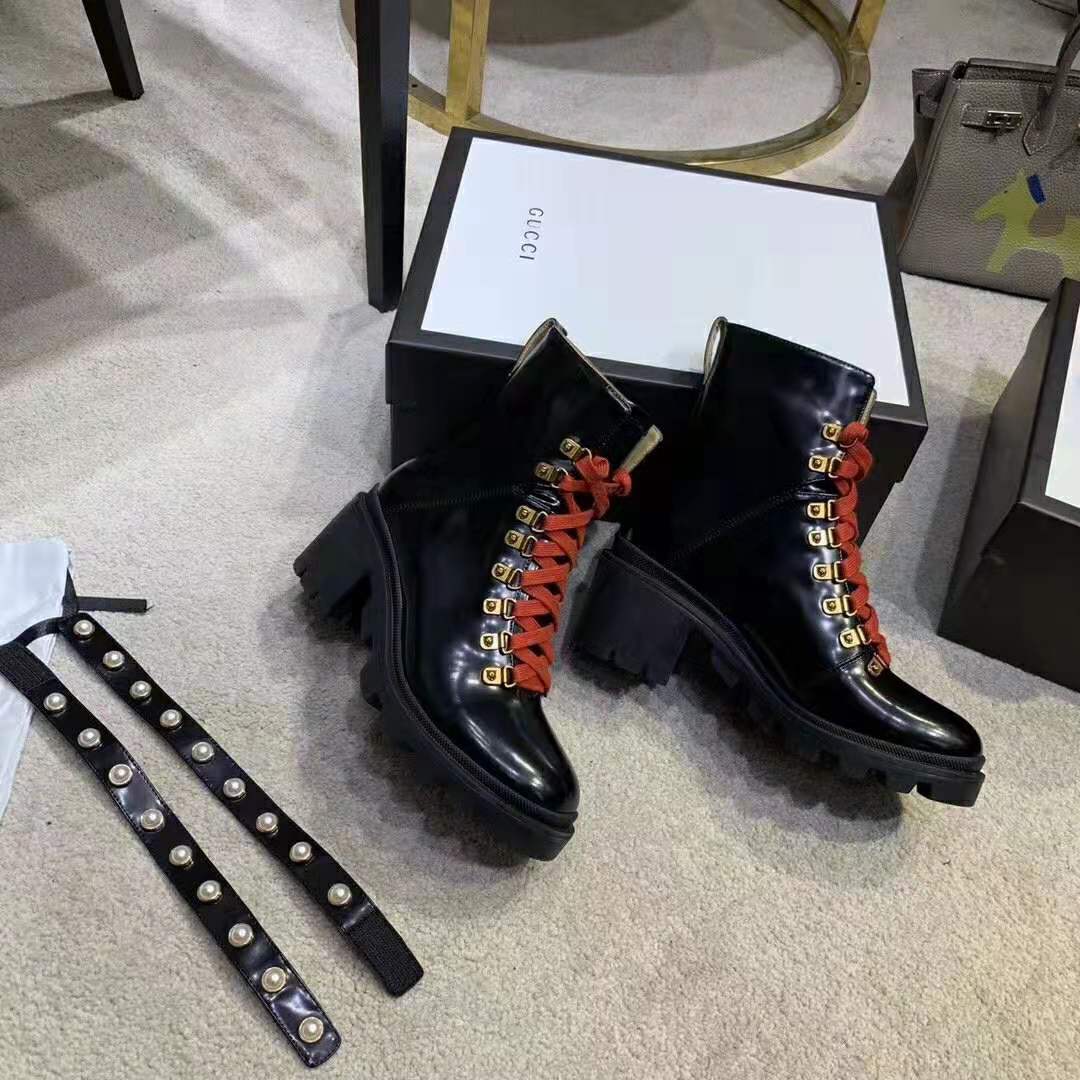 G*u*i women leather ankle boot with red laces in black shiny leather