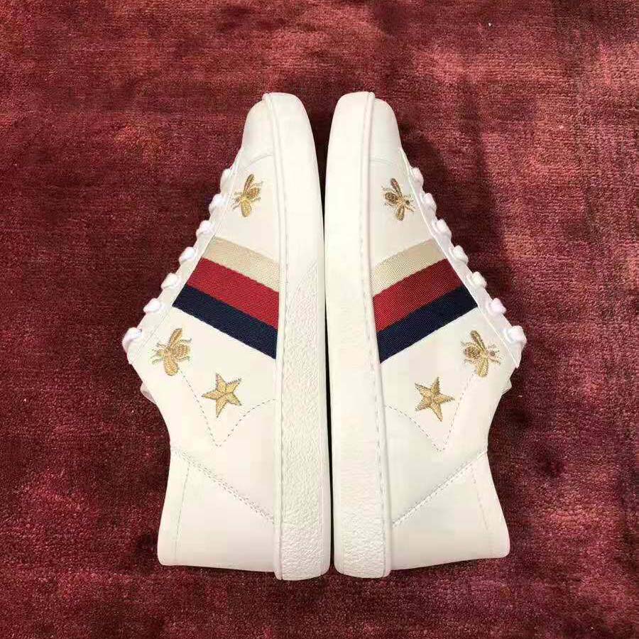 G*u*i women’s ace embroidered sneaker in white leather with bees and stars