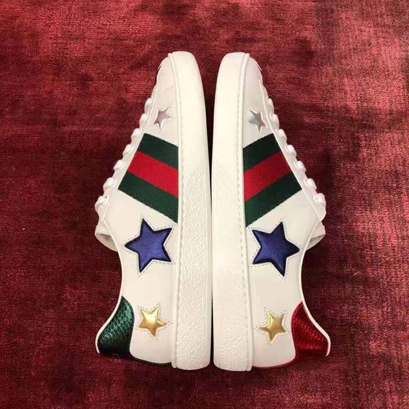 G*u*i women’s ace embroidered sneaker in white leather with inlaid multicolor stars