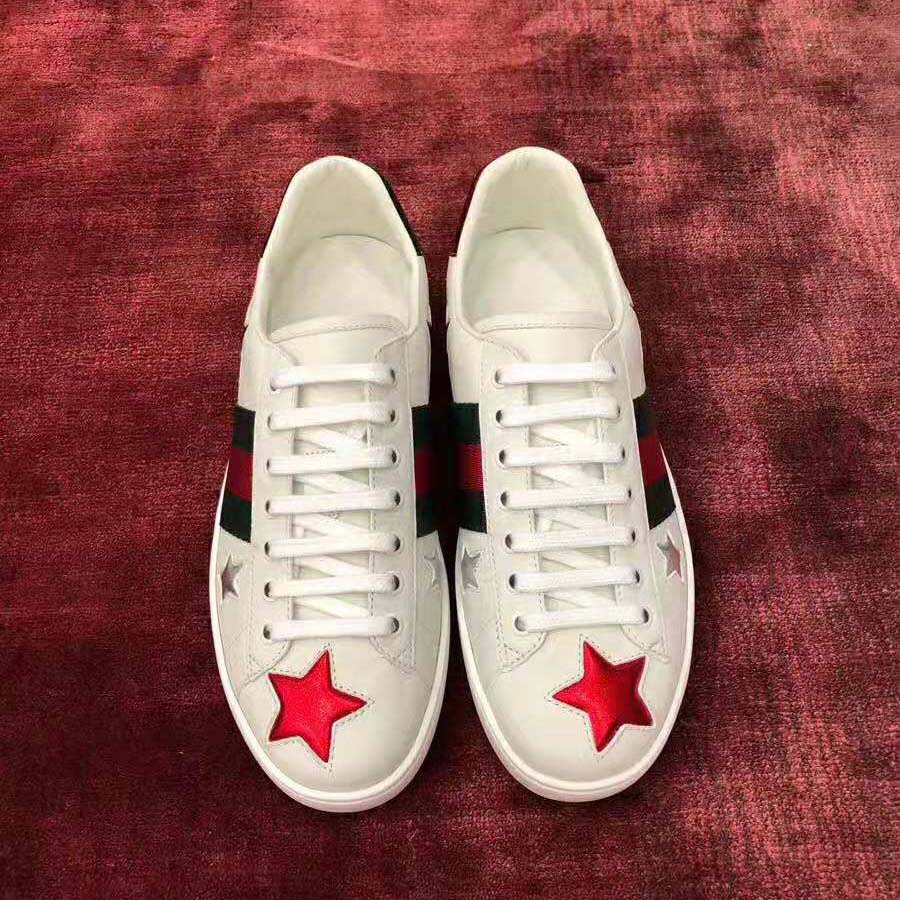 G*u*i women’s ace embroidered sneaker in white leather with inlaid multicolor stars