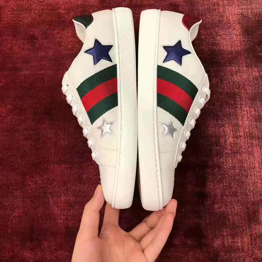 G*u*i women’s ace embroidered sneaker in white leather with inlaid multicolor stars