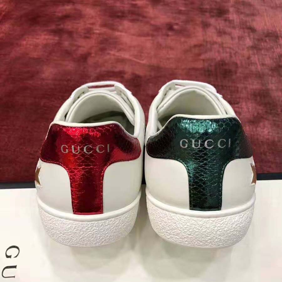 G*u*i women’s ace embroidered sneaker in white leather with inlaid multicolor stars
