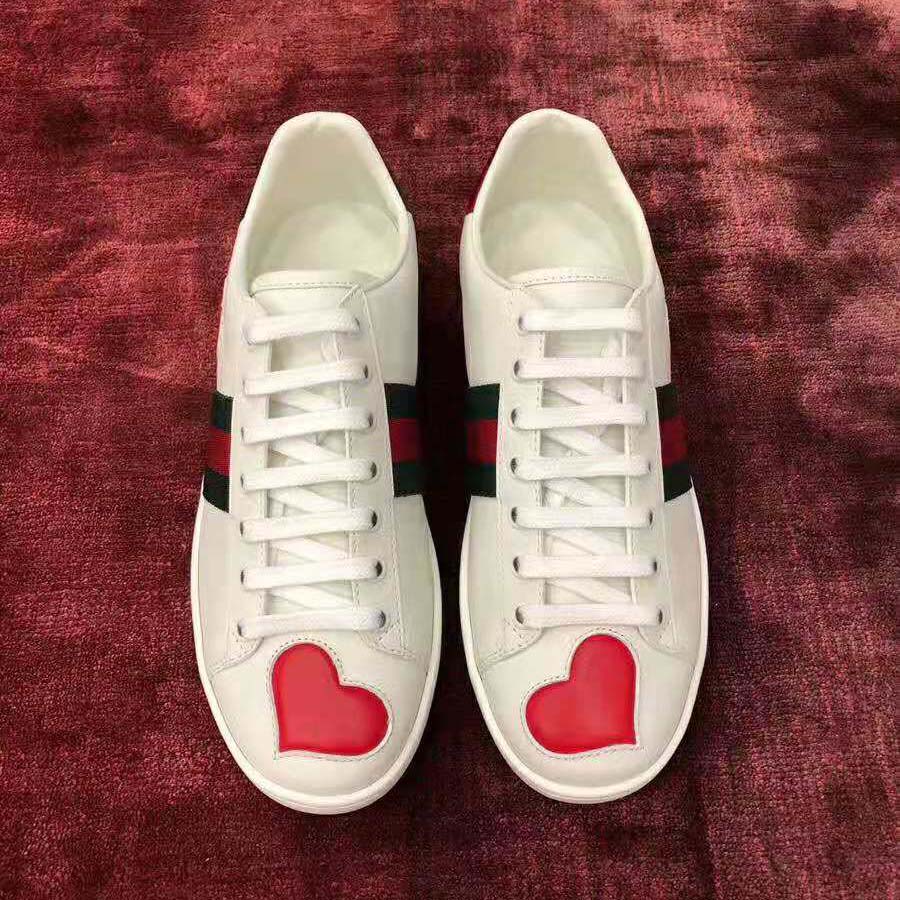 g*u*i women’s ace embroidered sneaker with two leather He**ts in rubber sole-white