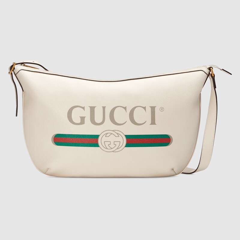 G*u*i gg unisex G*u*i print half-moon hobo bag in leather with G*u*i vintage logo