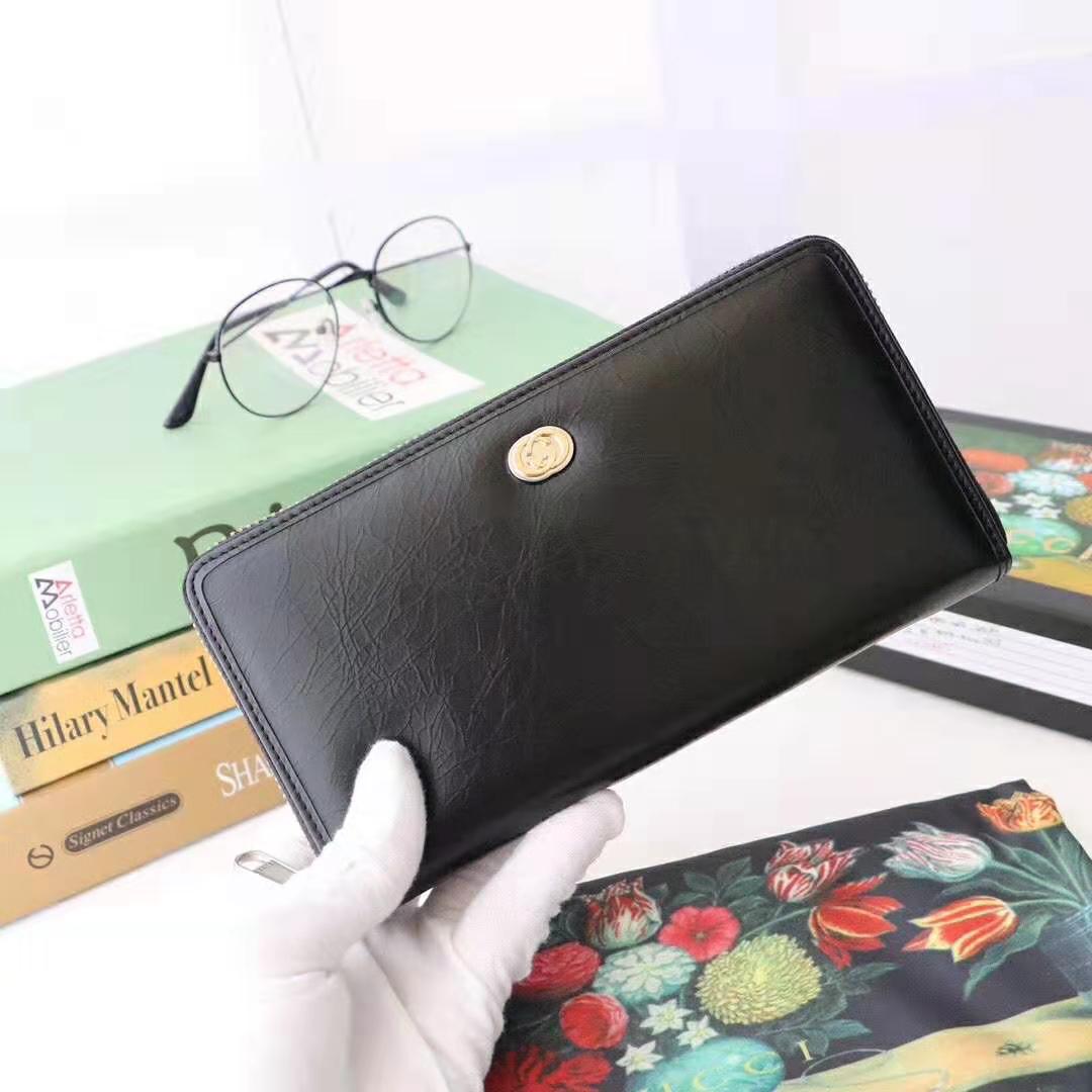 G*u*i gg men zip around wallet with interlocking g in black soft leather