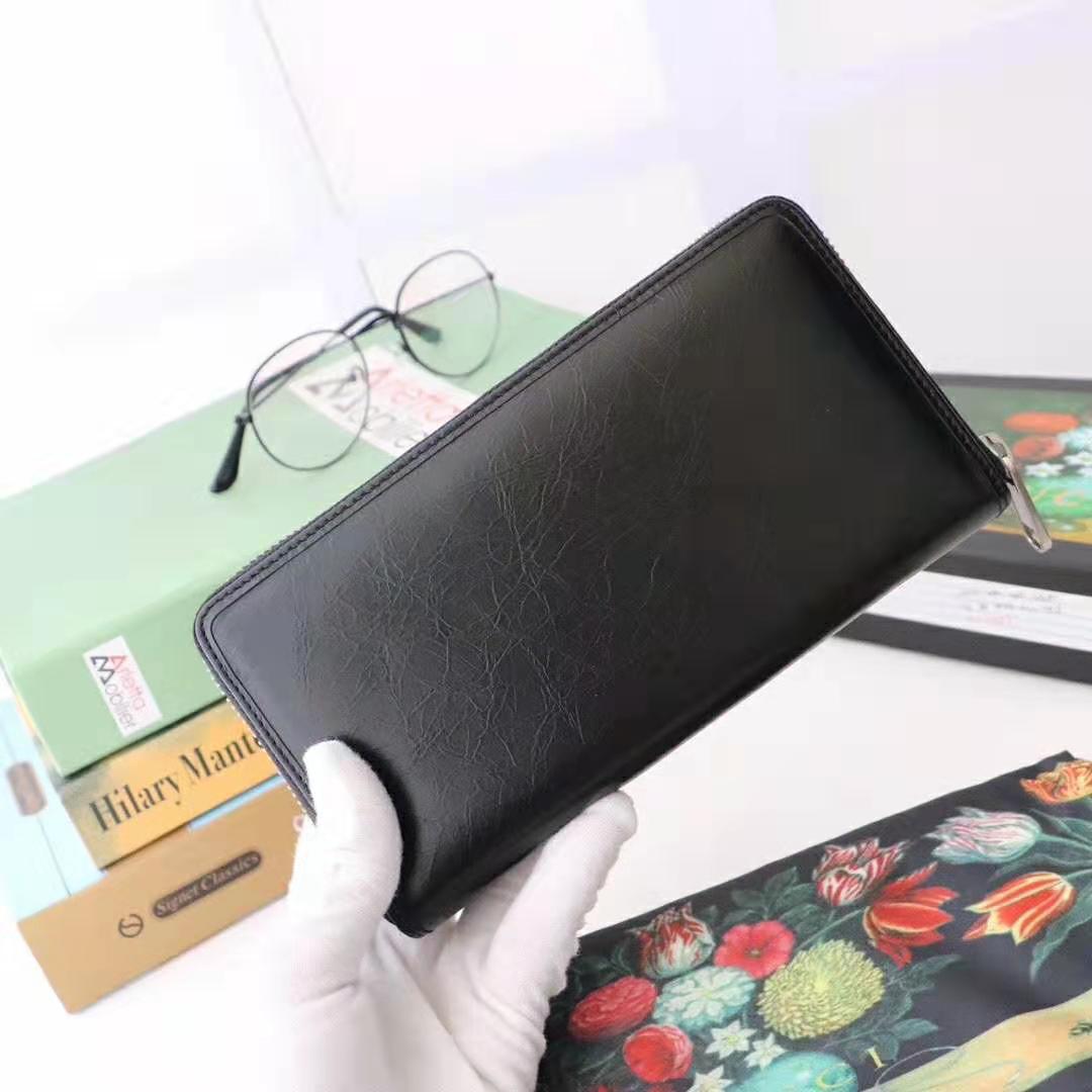 G*u*i gg men zip around wallet with interlocking g in black soft leather