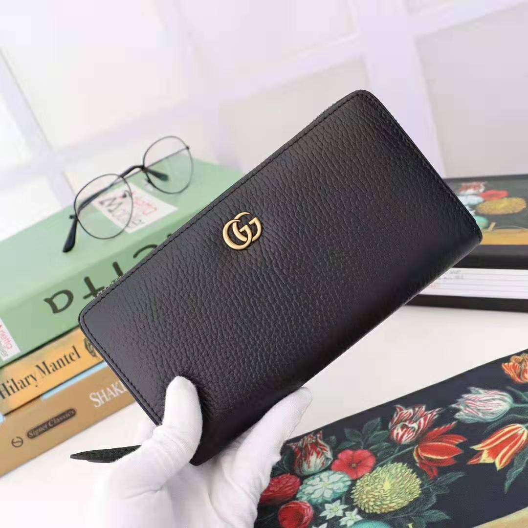 G*u*i gg unisex leather zip around wallet in black leather