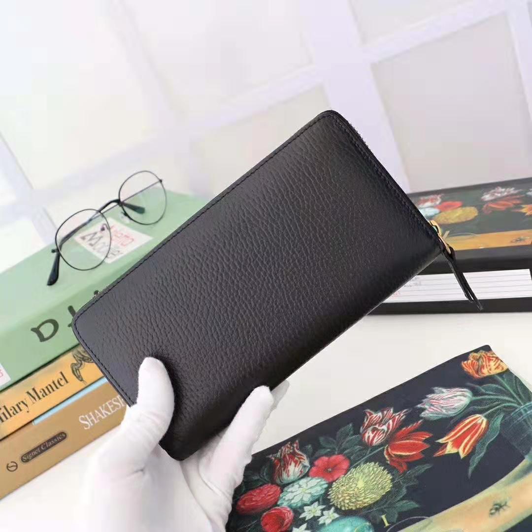 G*u*i gg unisex leather zip around wallet in black leather