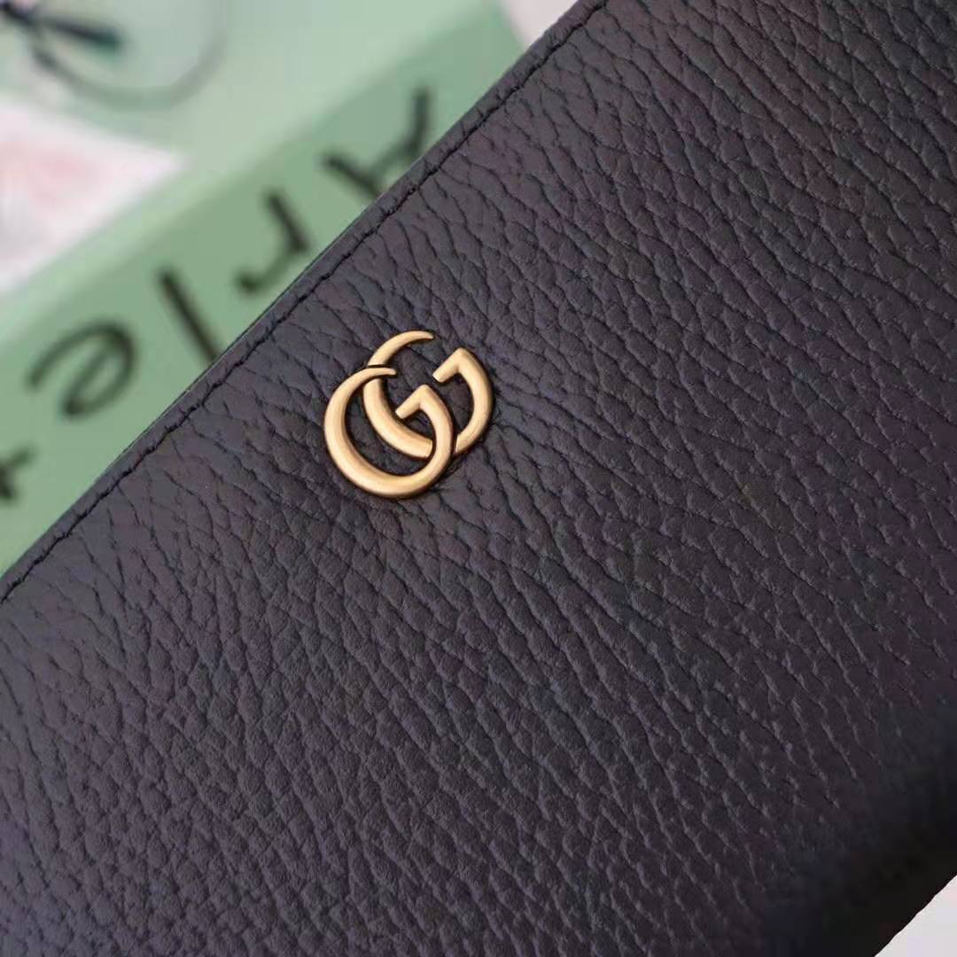 G*u*i gg unisex leather zip around wallet in black leather