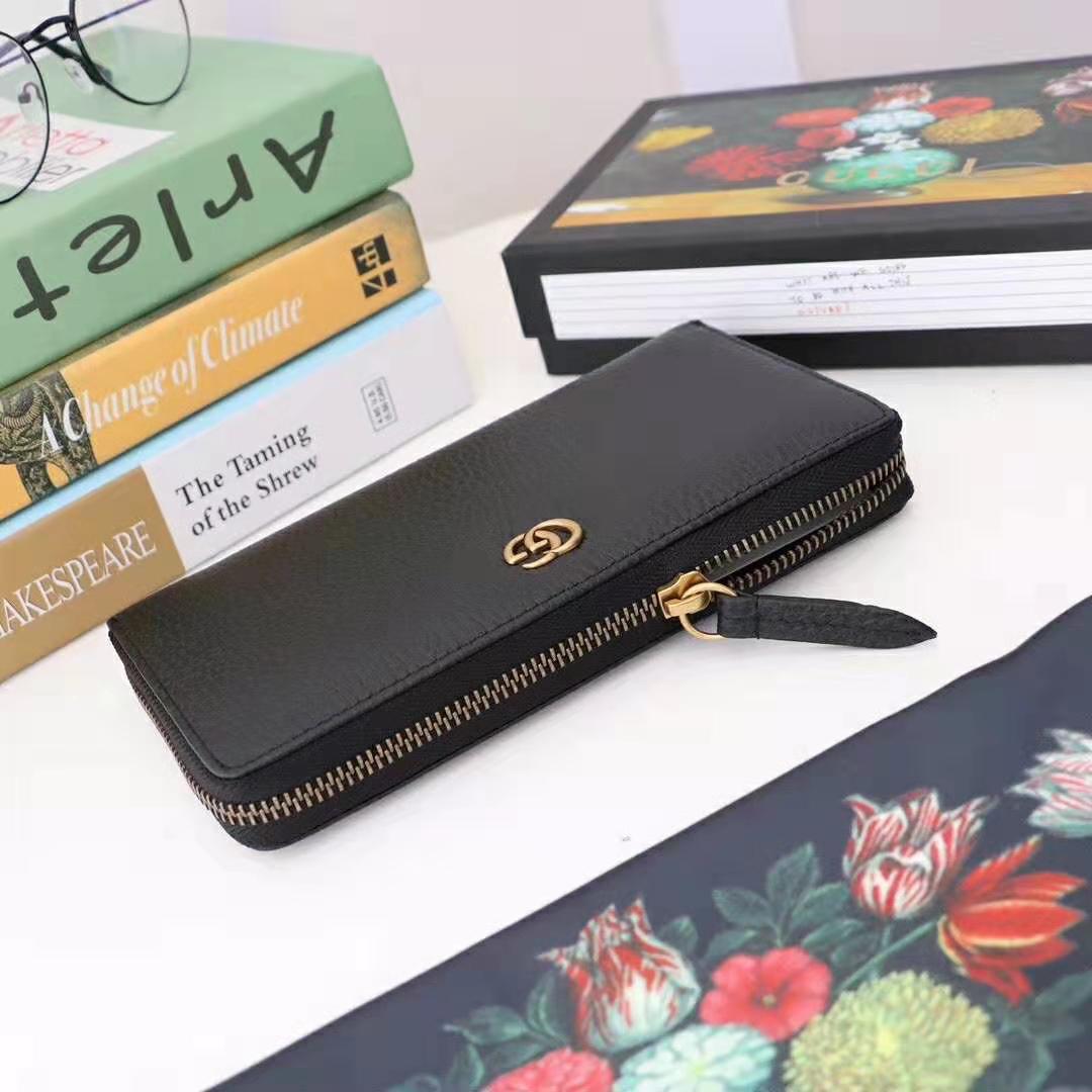 G*u*i gg unisex leather zip around wallet in black leather