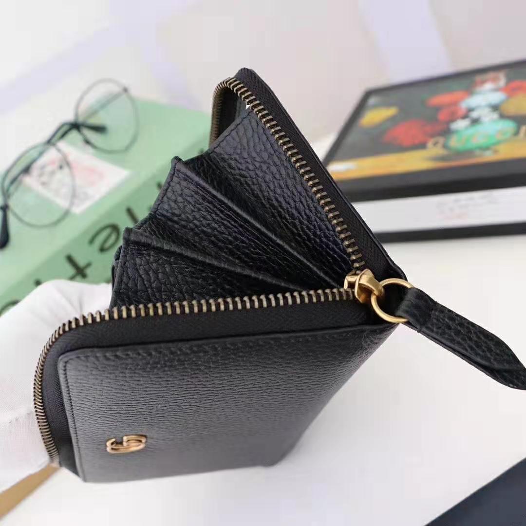 G*u*i gg unisex leather zip around wallet in black leather
