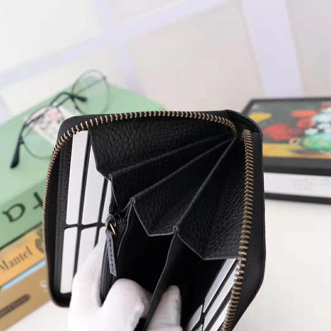 G*u*i gg unisex leather zip around wallet in black leather