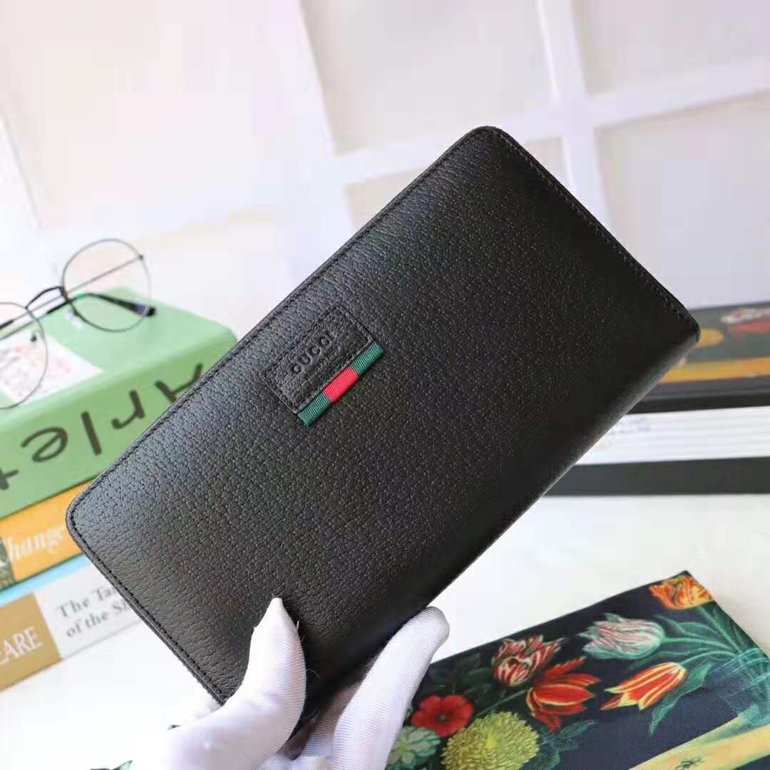 G*u*i gg unisex leather zip around wallet with web in black leather