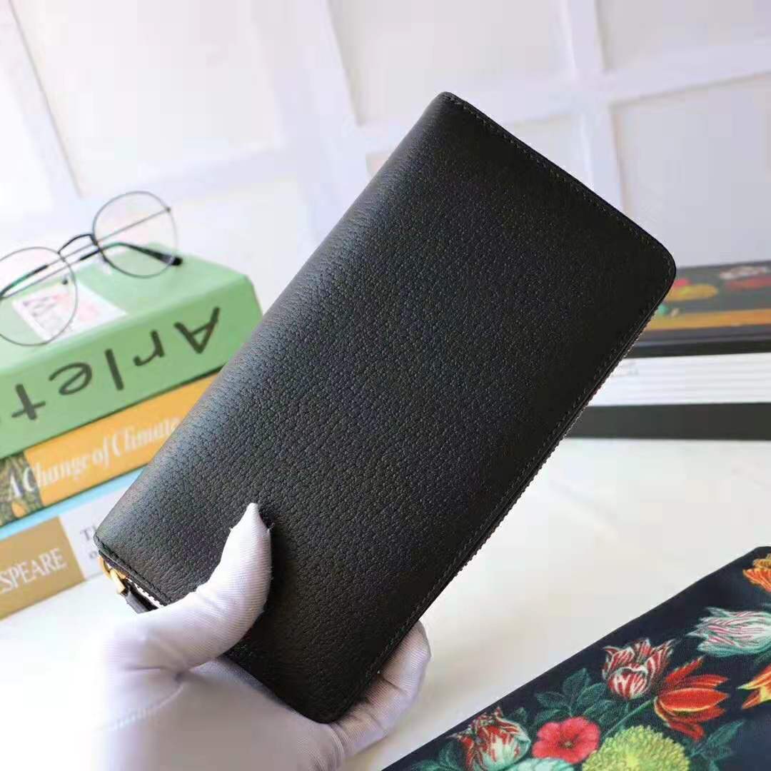 G*u*i gg unisex leather zip around wallet with web in black leather