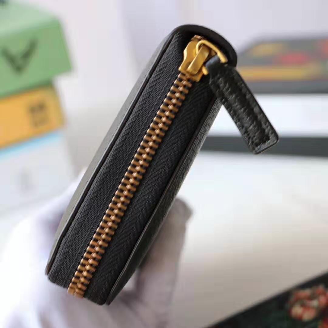 G*u*i gg unisex leather zip around wallet with web in black leather