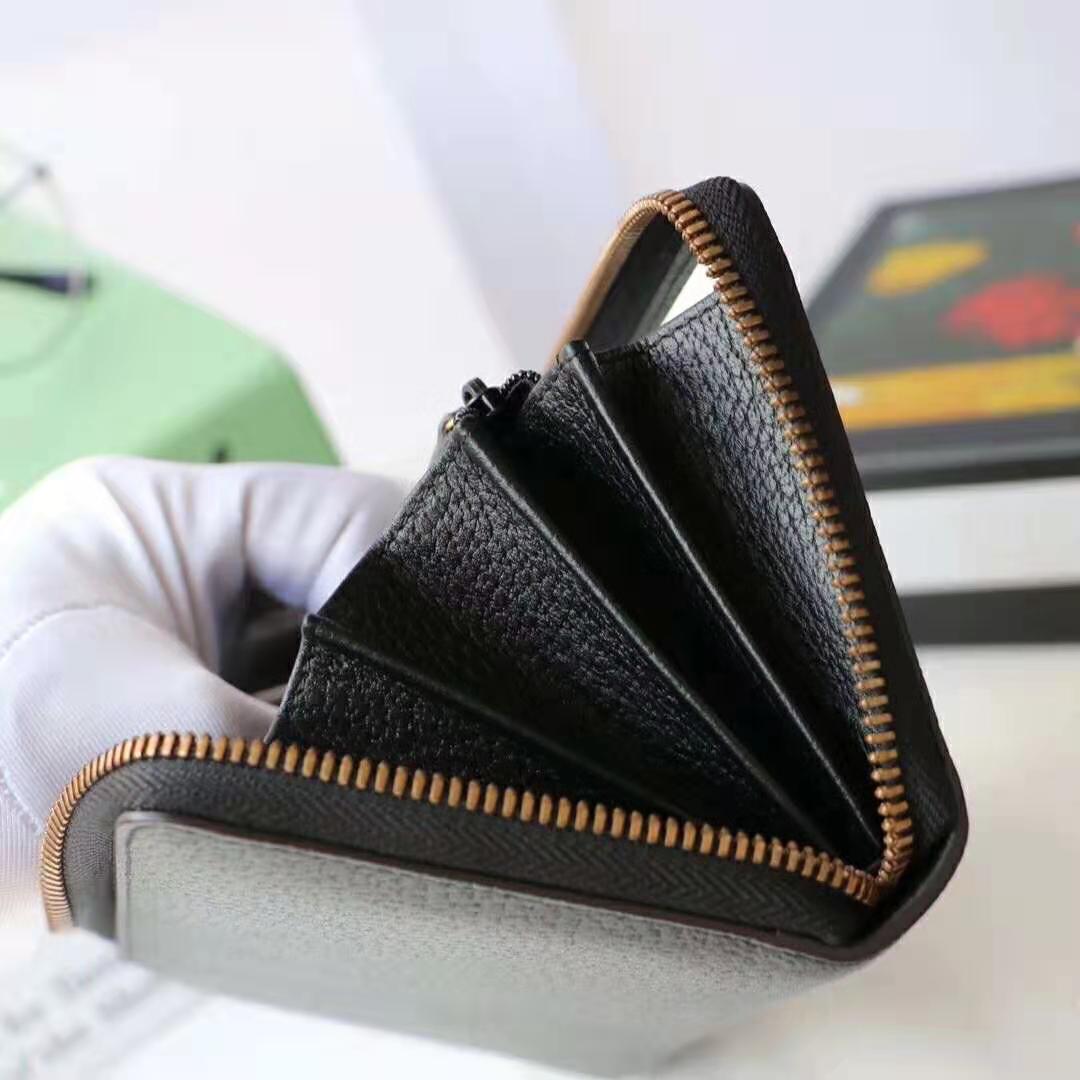 G*u*i gg unisex leather zip around wallet with web in black leather