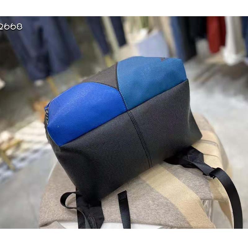 louis vuitton unisex discovery “v” logo backpack blue monoCh*0me taiga leather