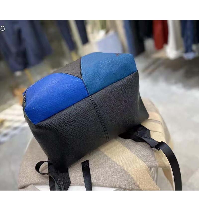 louis vuitton unisex discovery “v” logo backpack blue monoCh*0me taiga leather