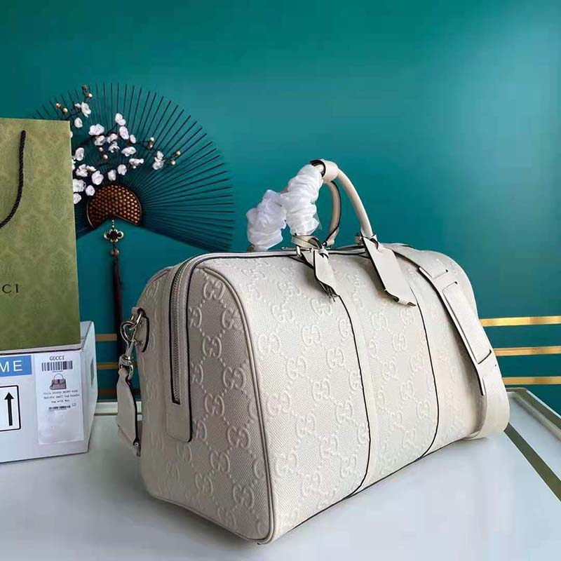 G*u*i gg unisex gg embossed duffle bag white gg embossed leather