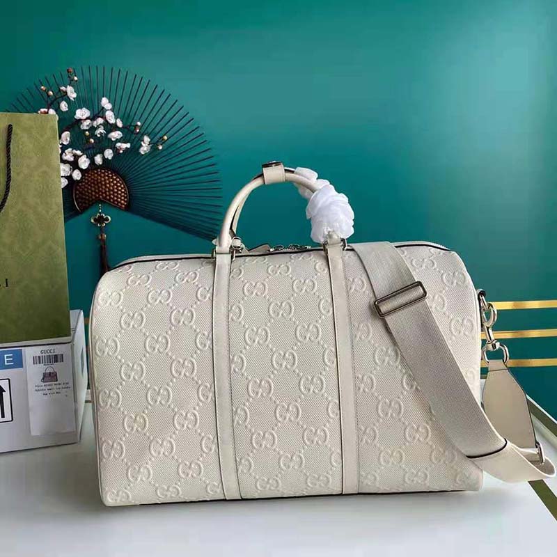 G*u*i gg unisex gg embossed duffle bag white gg embossed leather