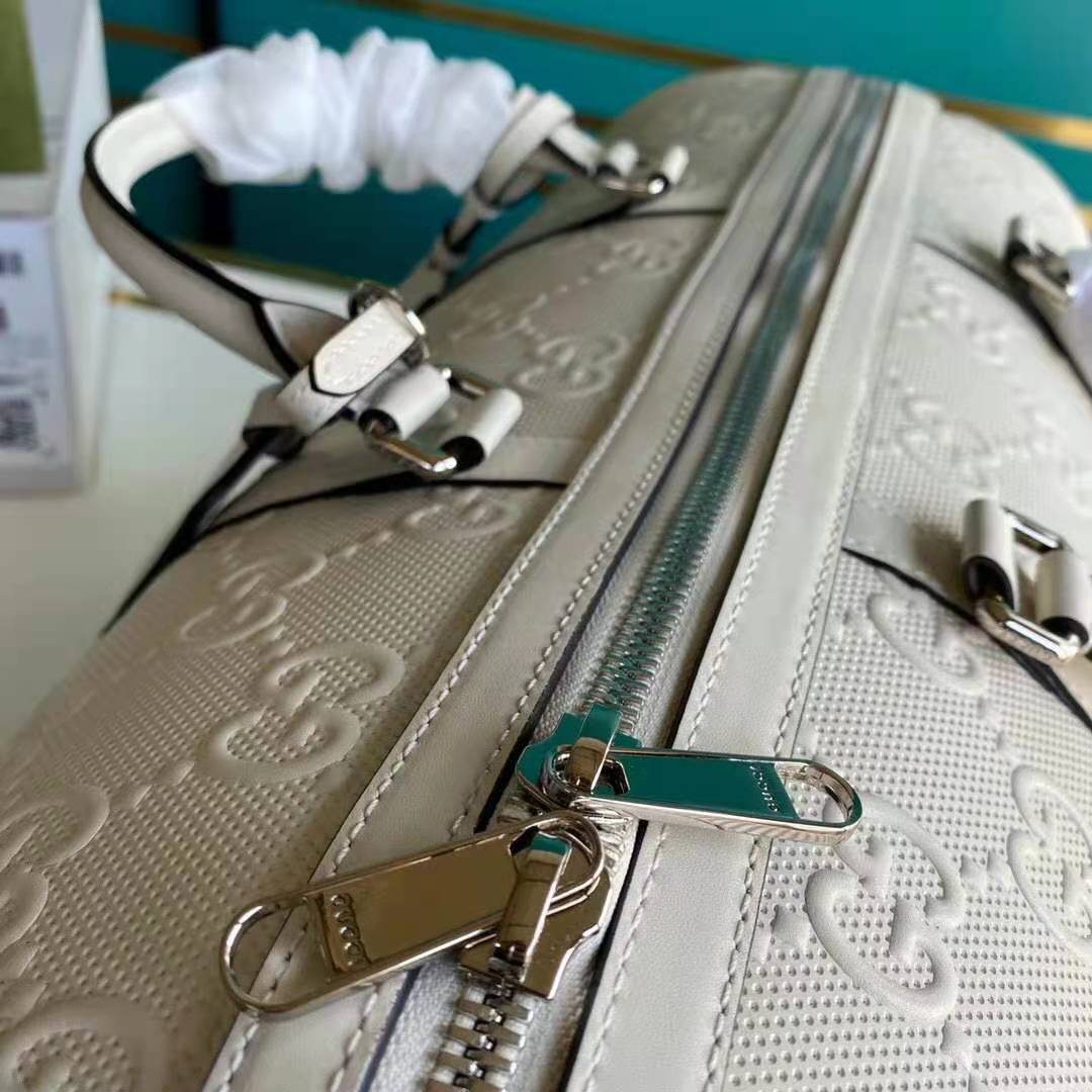G*u*i gg unisex gg embossed duffle bag white gg embossed leather