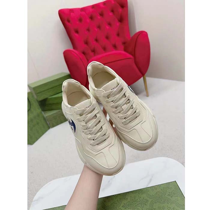 G*u*i unisex interlocking g rhyton sneakers ivory leather navy cut-out rubber sole